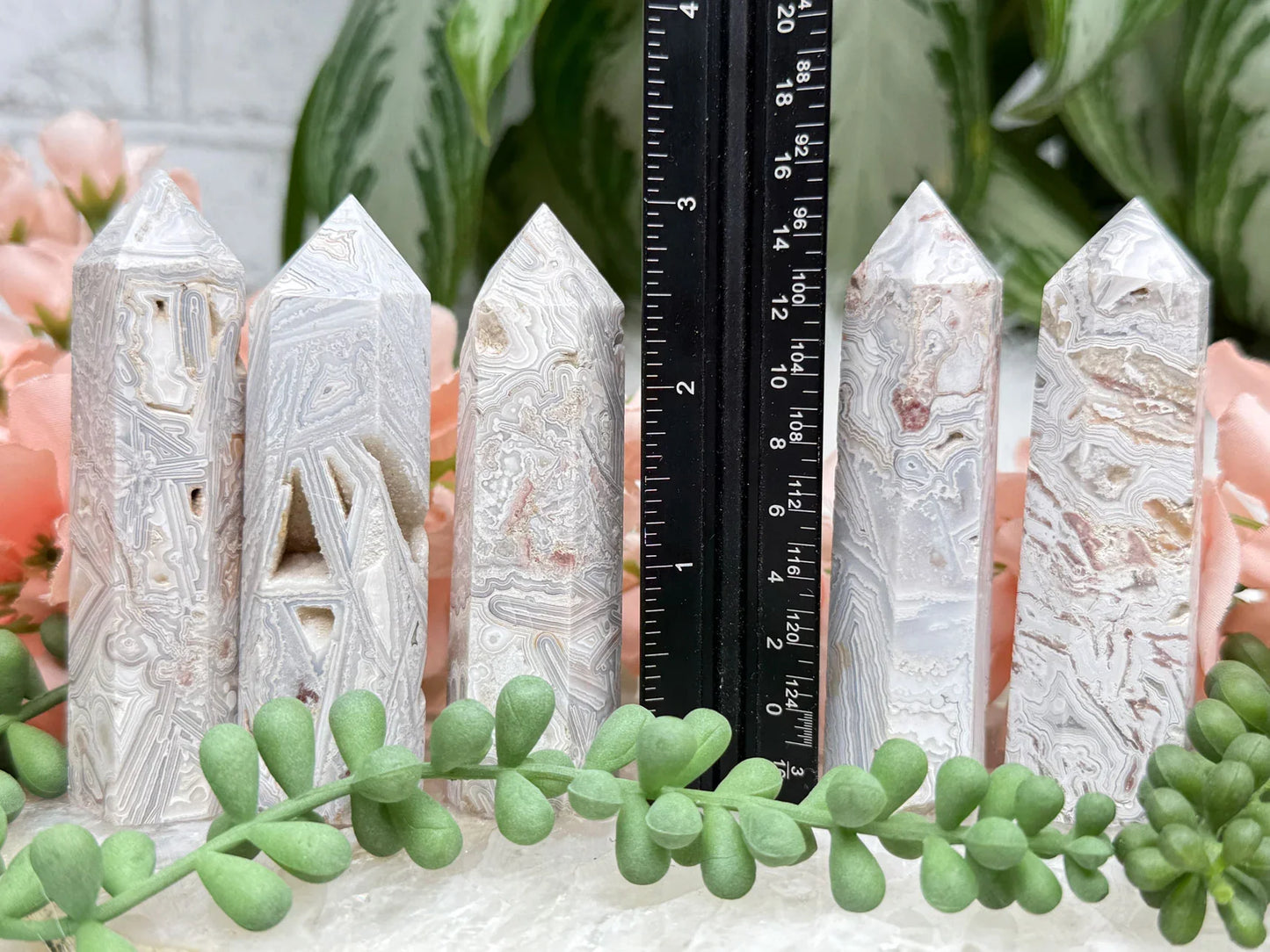 crazy-lace-agate-point-with-quartz-pockets