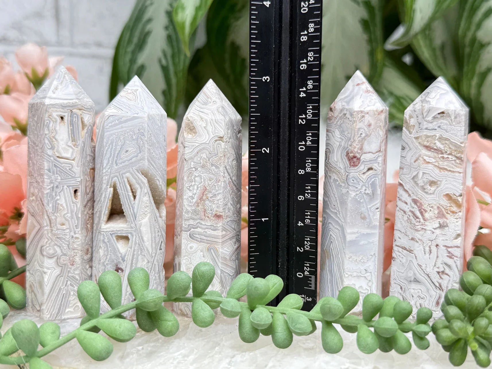 crazy-lace-agate-point-with-quartz-pockets