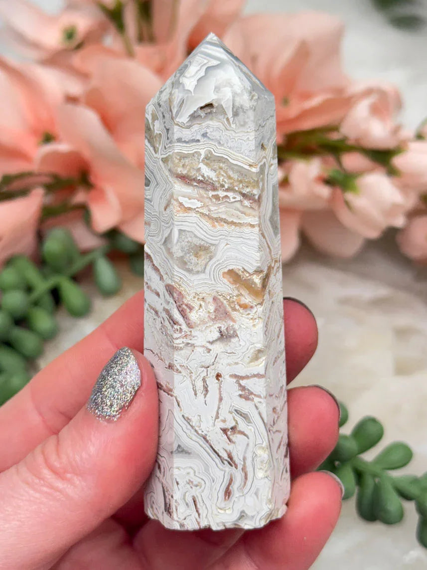 crazy-lace-agate-point-with-quartz-pockets