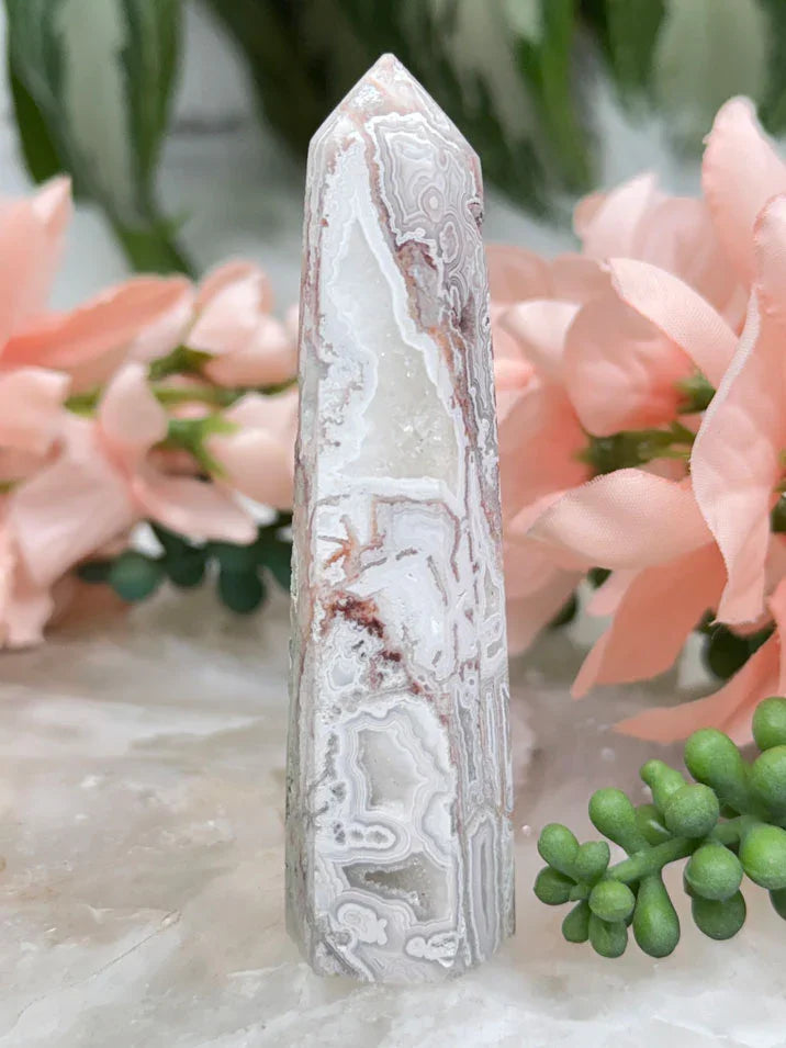 crazy-lace-agate-point-with-quartz-pockets