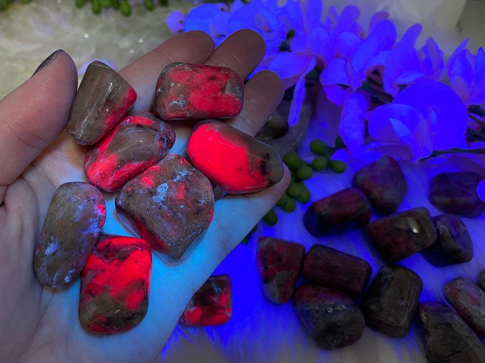 Glowing-UV-Tumbled-Ruby-Feldspar-for-Sale