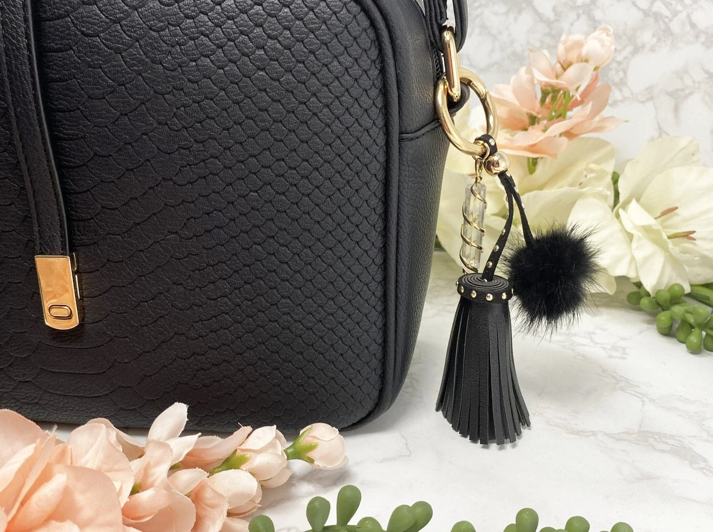 Carry your protective energies with you in style with this fashionable Quartz keychain! Made of vegan leather and vegan fur with little gold colored metal accents (gray has some silver accents)