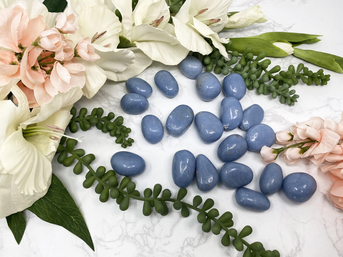 Blue Angelite Tumled Crystal Stones from Contempo Crystals. Blue Angelite is also known as blue anhyrdite.