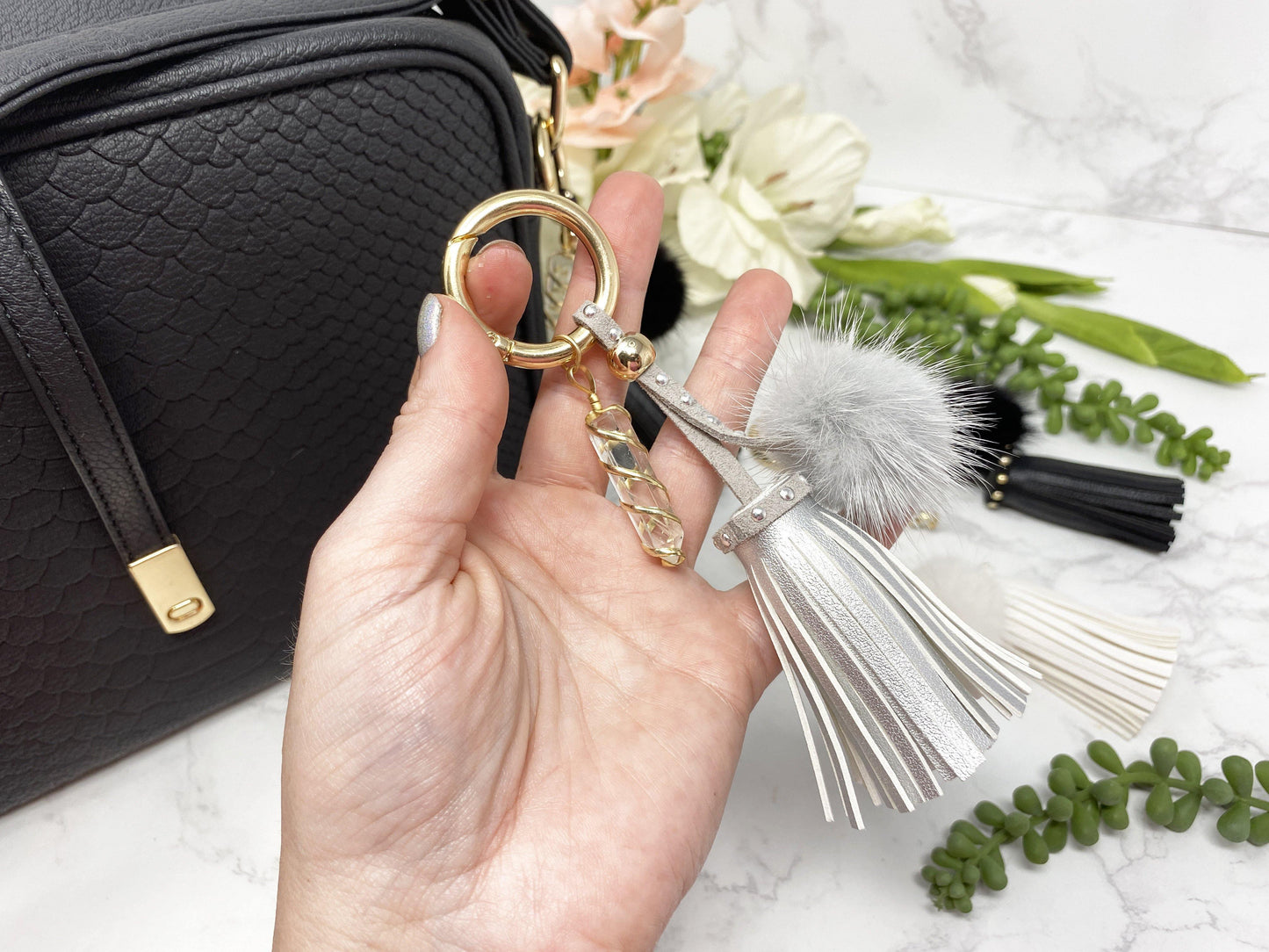 Carry your protective energies with you in style with this fashionable Quartz keychain! Made of vegan leather and vegan fur with little gold colored metal accents (gray has some silver accents)