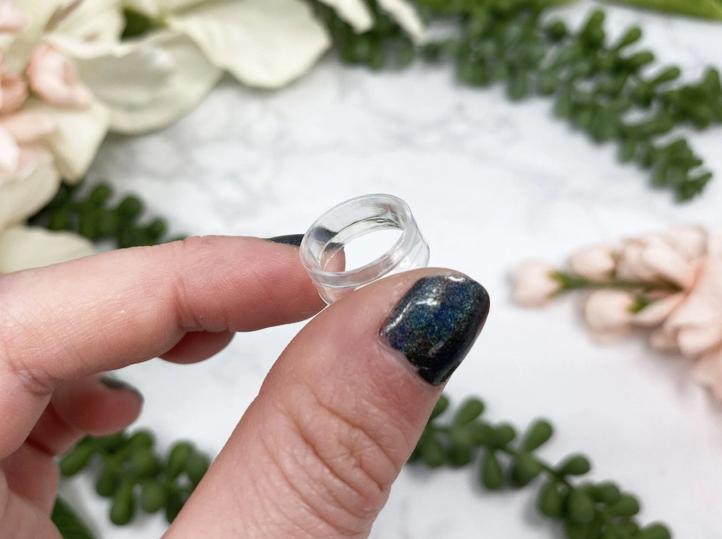 Small plastic sphere stands from Contempo Crystals Shop for holding crystal spheres.