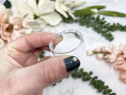 Plastic sphere stands in hand