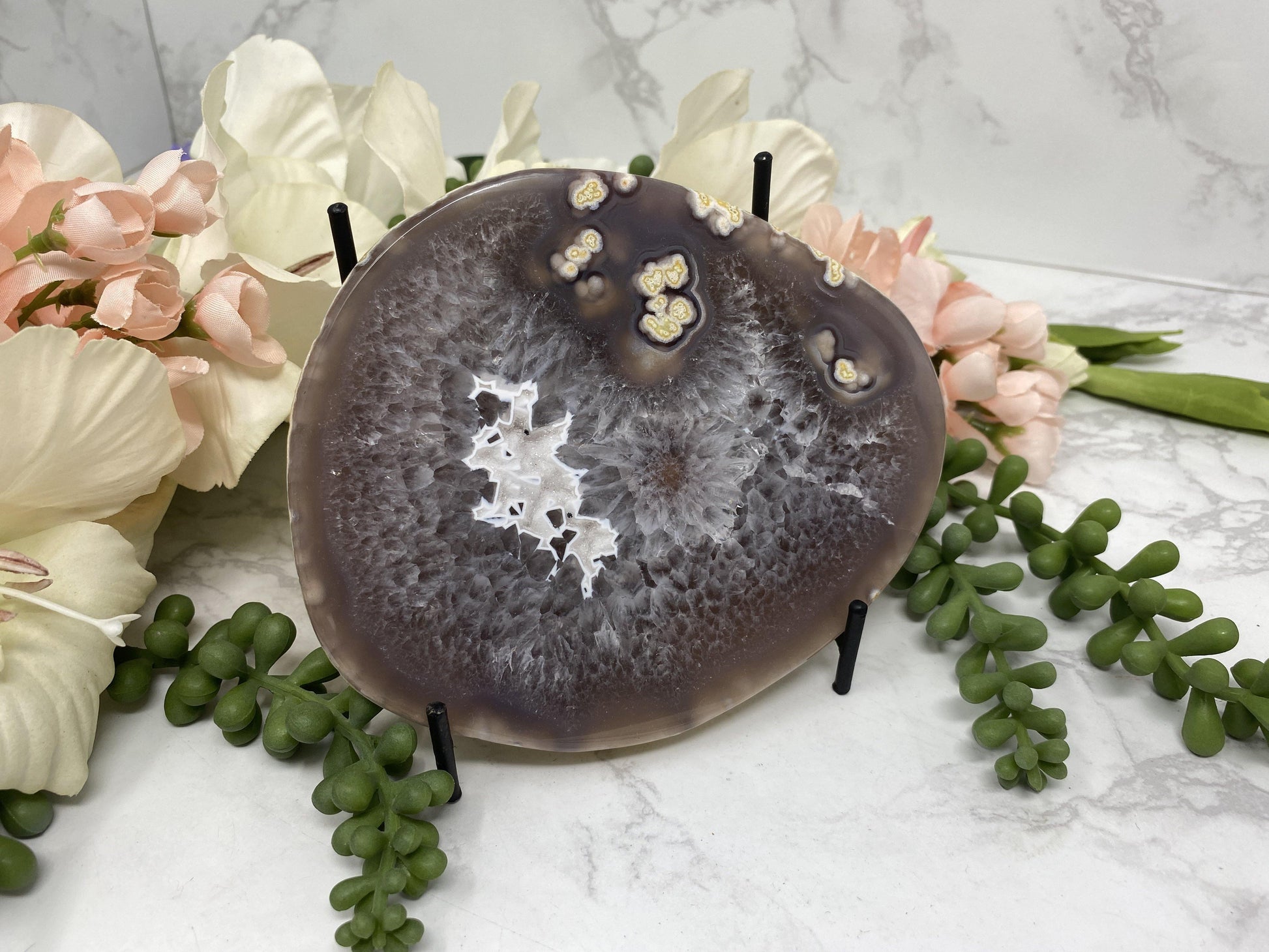 These simple metal stands are perfect for propping up slabs or display crystals that usually just sit flat.