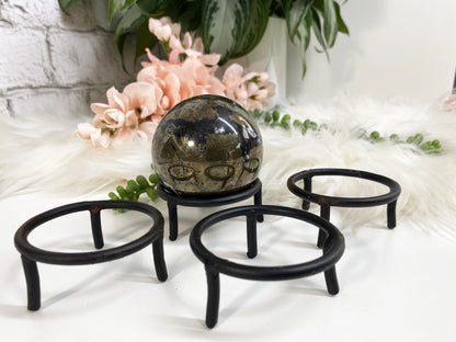These simple black metal sphere stands are perfect for holding your favorite spheres or eggs. 