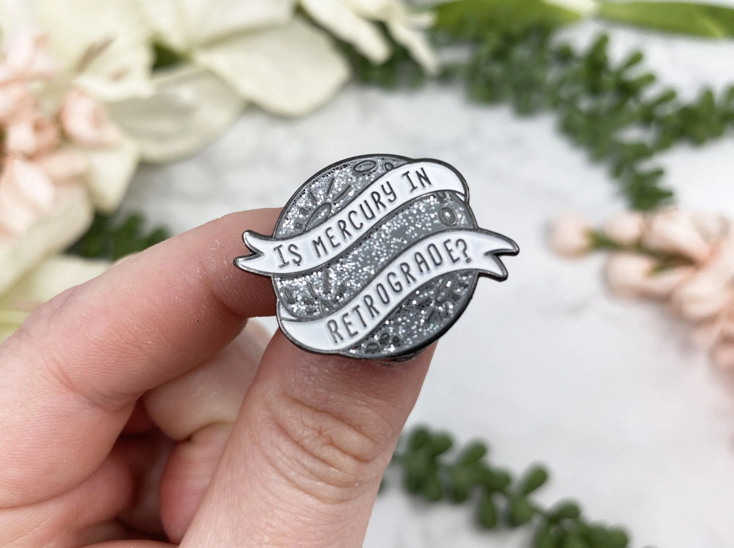 Silver Sparkle Mercury Retrograde Lapel Pin. Fun little gift from the Contempo Crystals Shop!