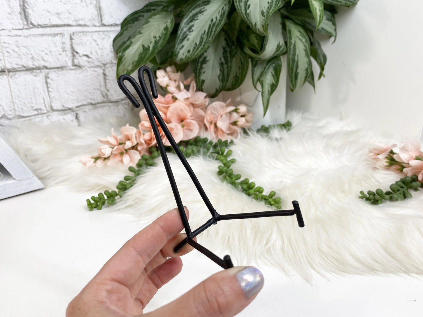 Easel metal display stands. These simple metal stands are perfect for propping up slabs or display crystals that usually just sit flat.