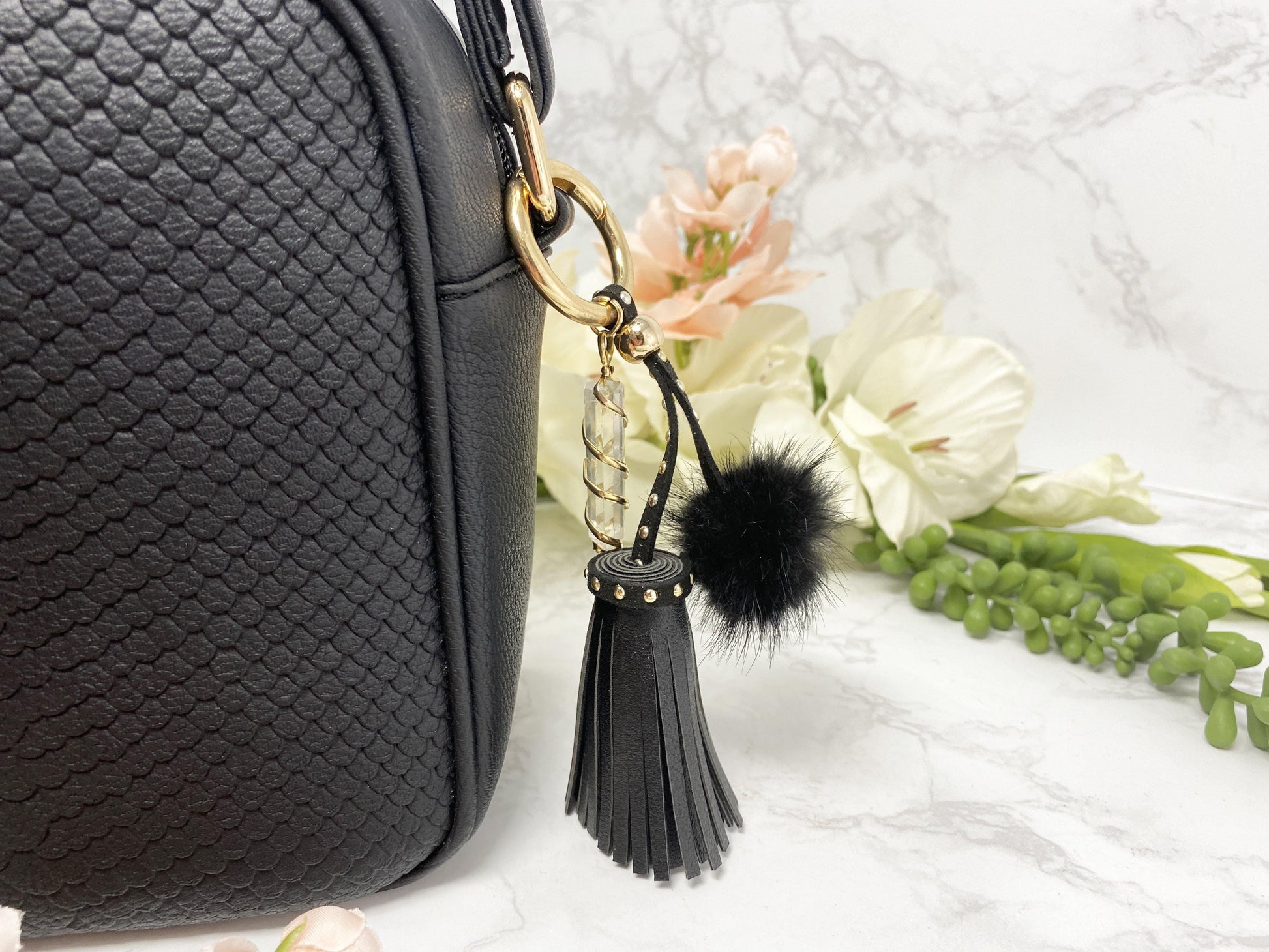 Carry your protective energies with you in style with this fashionable Quartz keychain! Made of vegan leather and vegan fur with little gold colored metal accents (gray has some silver accents)