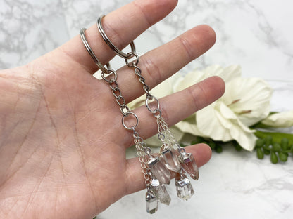Clear quartz crystal point keychains.