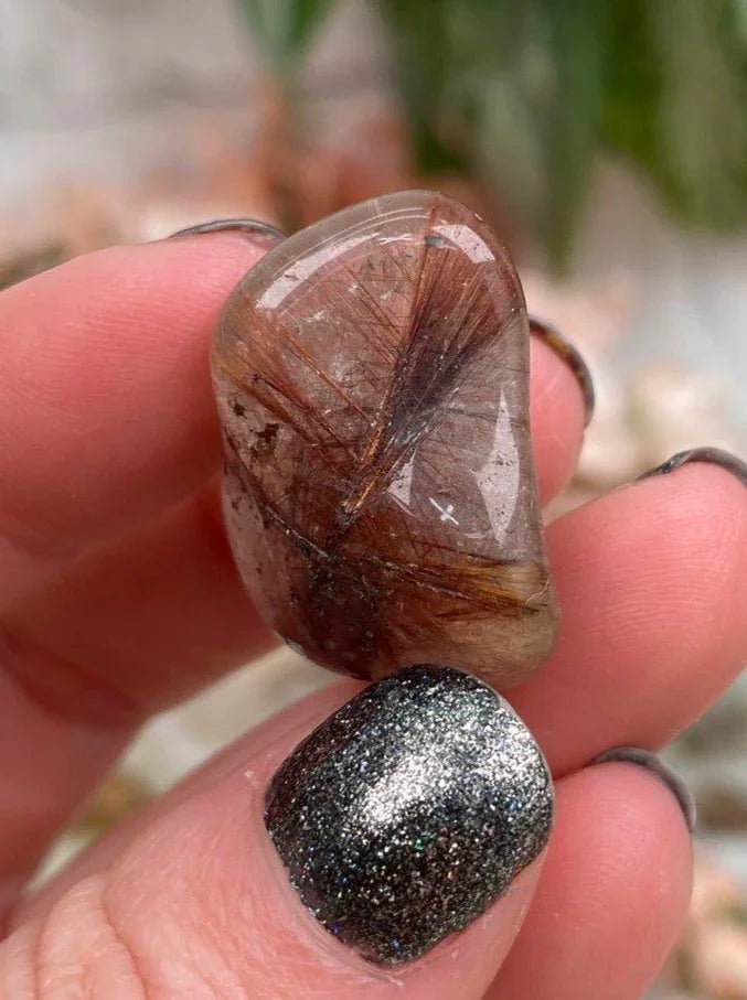 Tumbled-Red-Rutile-in-Clear-Quartz