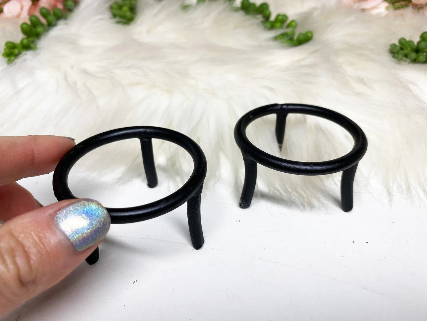 These simple black metal sphere stands are perfect for holding your favorite spheres or eggs. 