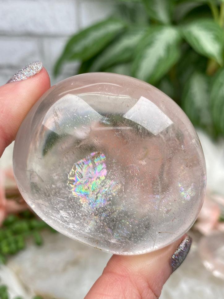clear-quartz-palm-stone-with-rainbow