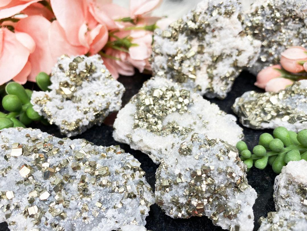    gold-pyrite-crystals-on-raw-quartz