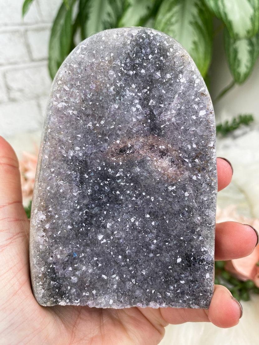 pink-eye-in-amethyst-cluster