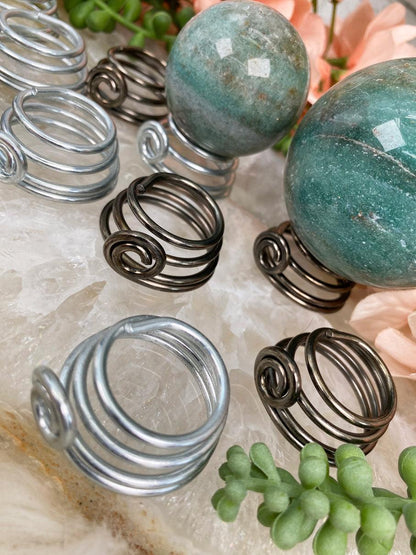 silver-bronze-metal-sphere-stands