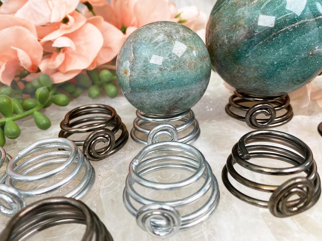 silver-bronze-twist-metal-sphere-stand